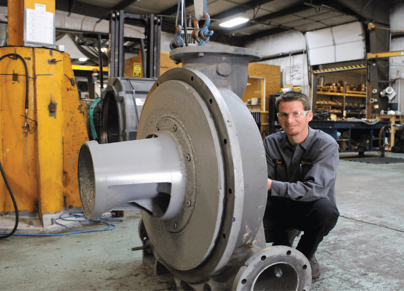 Jesse next to a large product to be delivered to a customer