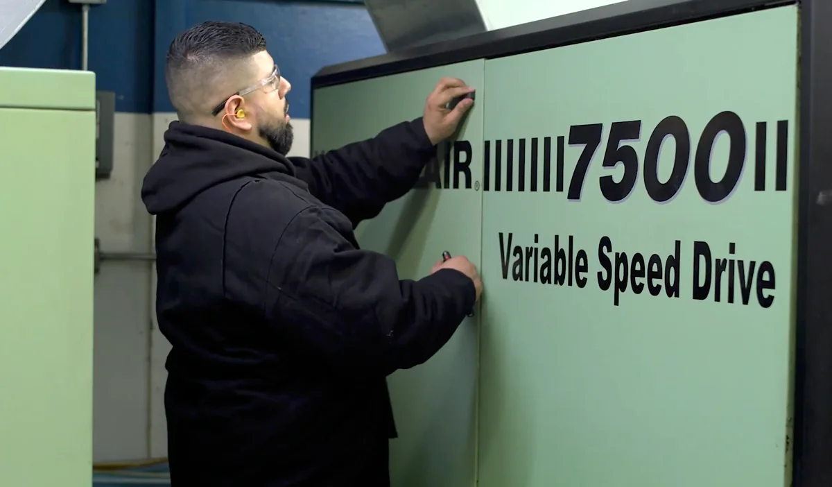 Brabazon technician servicing a Sullair 7500 variable speed drive air compressor