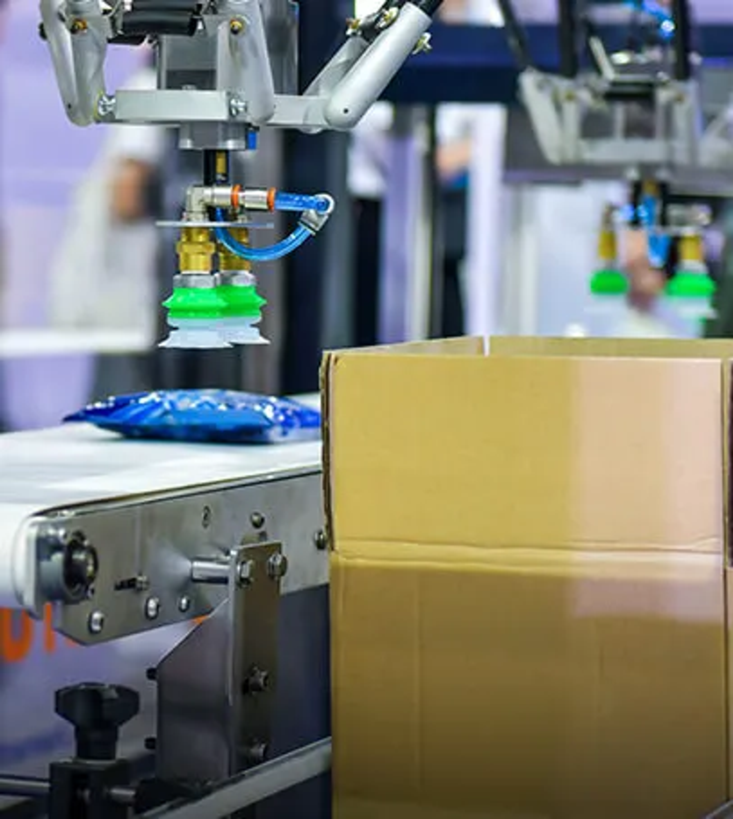 Packaging line using compressed air and vacuum systems