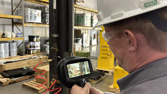 Technician using an instrument to inspect an industrial compressed-air system
