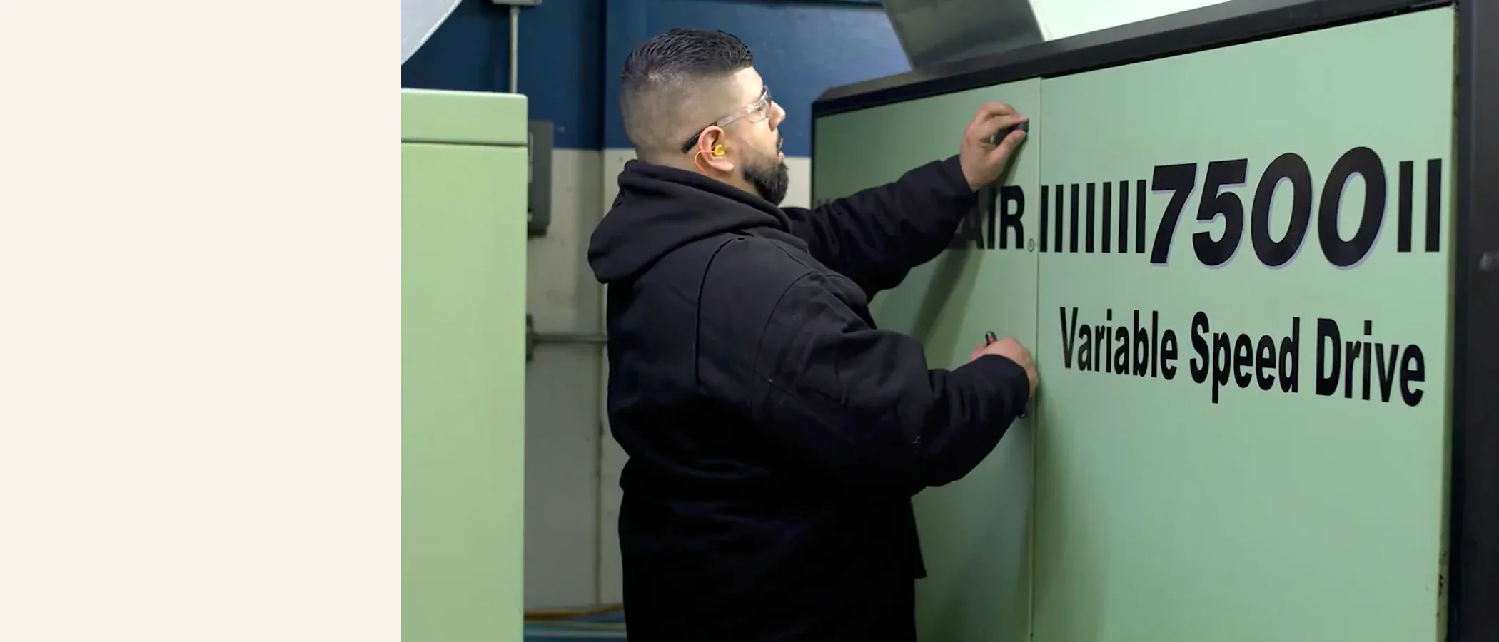Technician servicing a Sullair 7500 VSD compressor