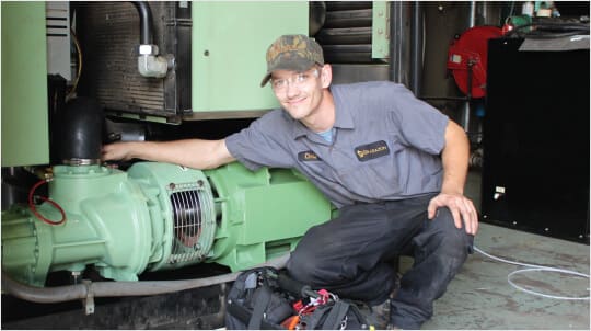 Brabazon technician performing an industrial air compressor repair